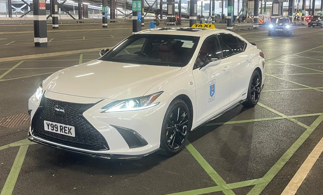 White Lexus ES300h F Sport operated by Find My Cab