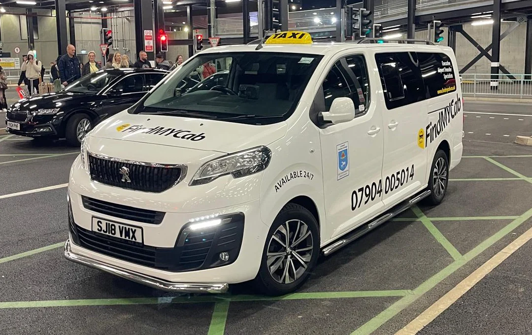 White Peugeot Expert operated by Find My Cab